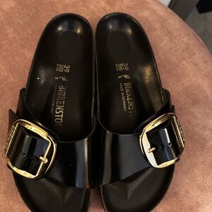 Birkenstock Glossy Black Slides with Gold Buckle
